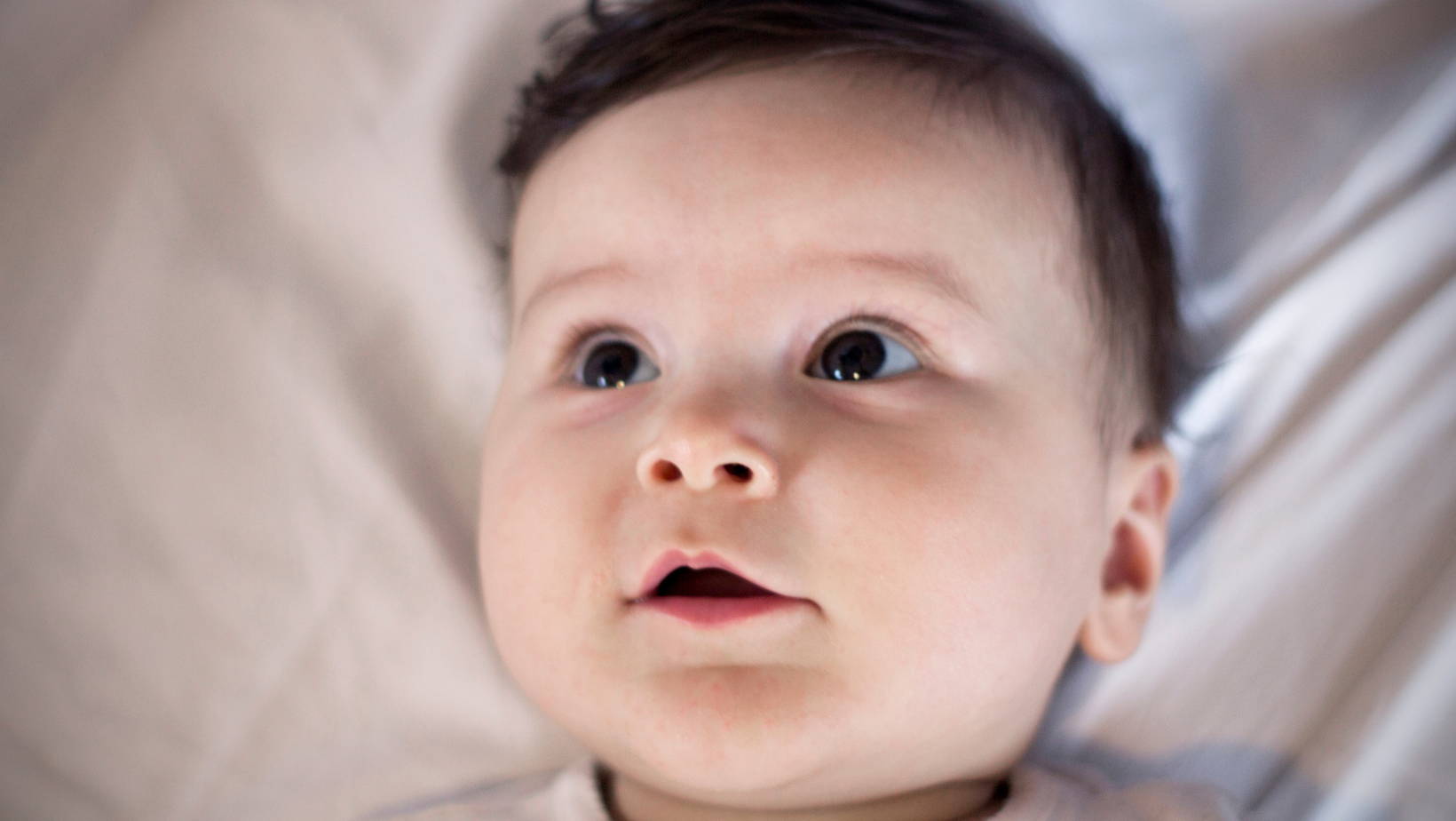 Why do Babies Look up at the Ceiling and Smile?